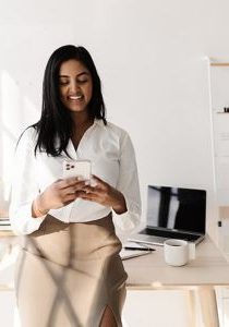 young-professional-woman-of-color-on-her-smart-phone